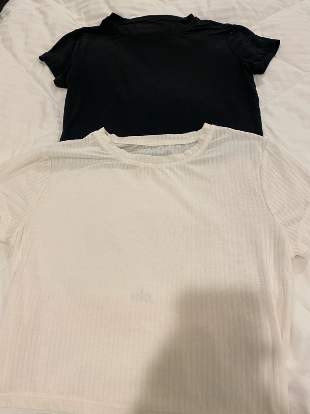 Alo yoga tees 

2 quantity one black one cream